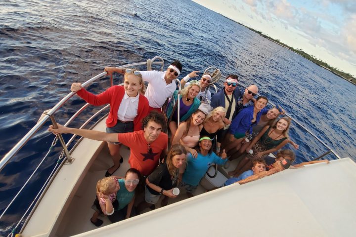 a group of people in a boat on a body of water