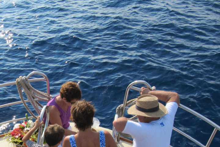 a group of people in a boat on a body of water