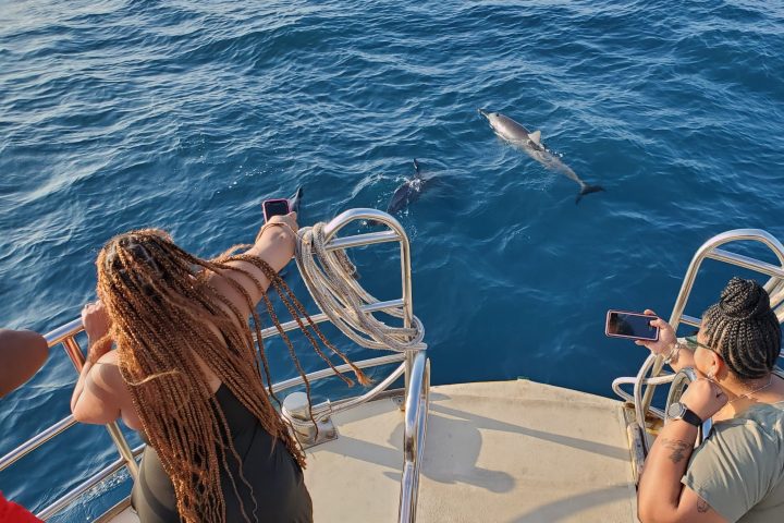 a person standing next to a body of water