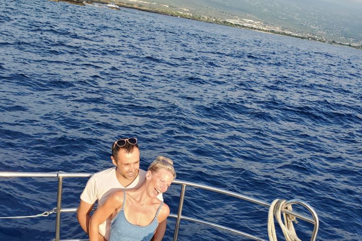 a person standing next to a body of water